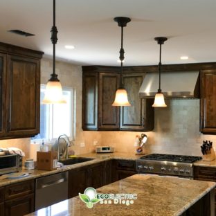 3 Energy Efficient Lighting fixtures over a kitchen island
