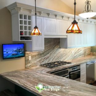 Energy Efficient recessed lighting and hanging lights in a modern kitchen