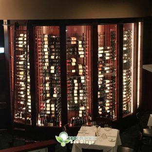 Top down view of Energy Efficient Lighting in a deluxe wine cabinet with hundreds of bottles
