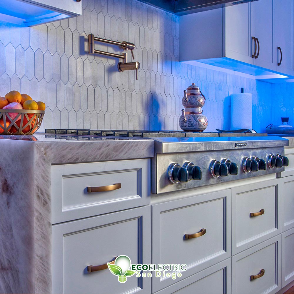 Recessed lighting under cabinets glows blue