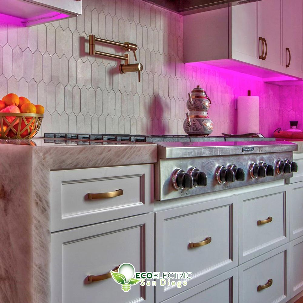 Recessed lighting under cabinets glows pink